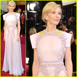 Cate Blanchett-2011-oscars-wore a Givenchy Couture dress with beautiful yellow detailing on the black along with Van Cleef & Arpels jewelry